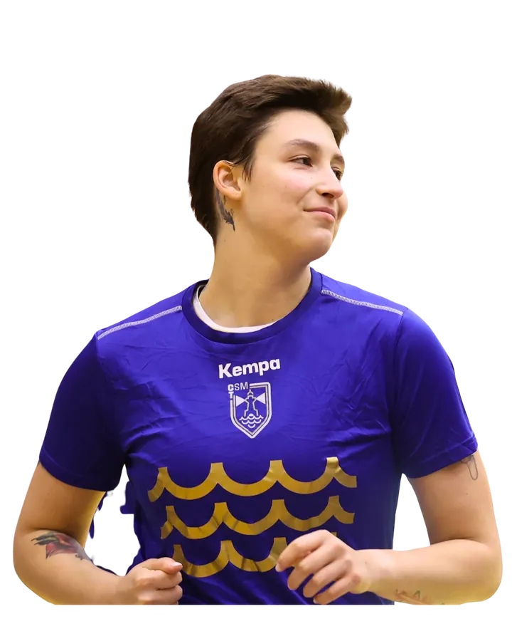 Laura smiling in her basketball team jersey